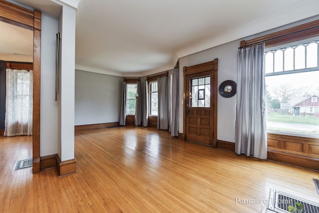 foyer entrance with light hardwood / wood-style floors