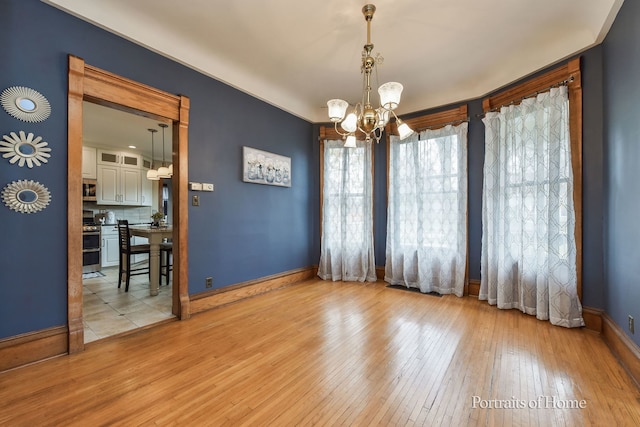 interior space featuring a chandelier and light hardwood / wood-style flooring