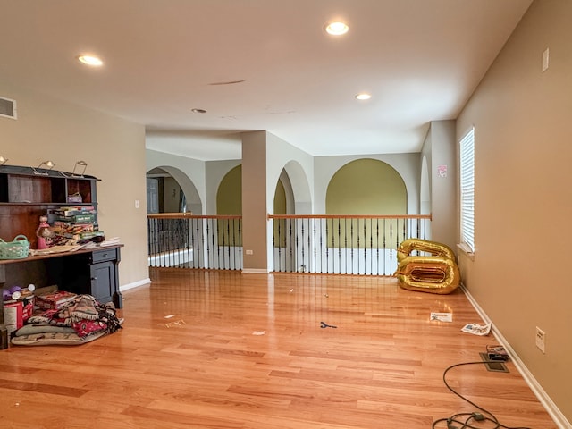 spare room featuring hardwood / wood-style flooring