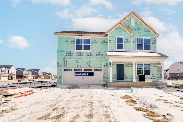 property under construction featuring a residential view and an attached garage