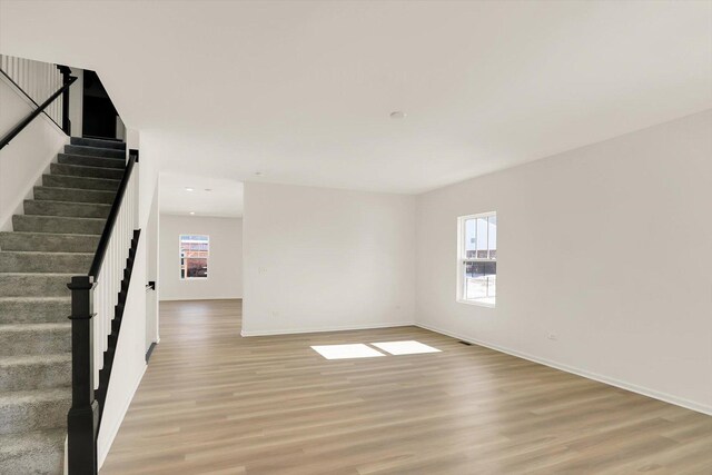 sitting room featuring hardwood / wood-style flooring and an inviting chandelier