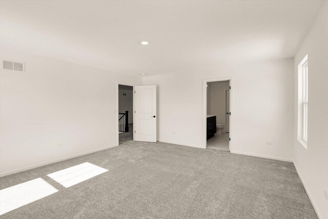 carpeted bedroom with vaulted ceiling and a notable chandelier