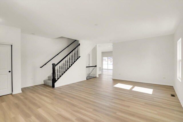 living room with dark hardwood / wood-style flooring and a notable chandelier