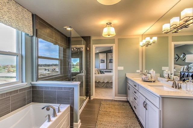 bathroom featuring separate shower and tub, vanity, a healthy amount of sunlight, and wood-type flooring