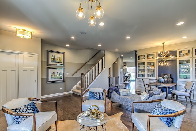 living room with a chandelier and hardwood / wood-style flooring