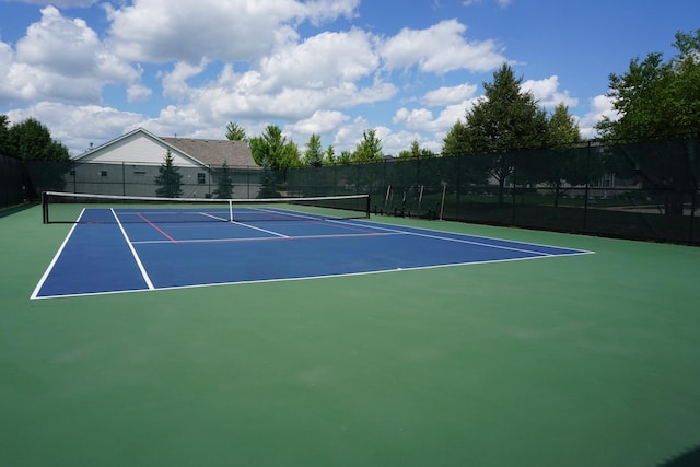 view of sport court with basketball hoop