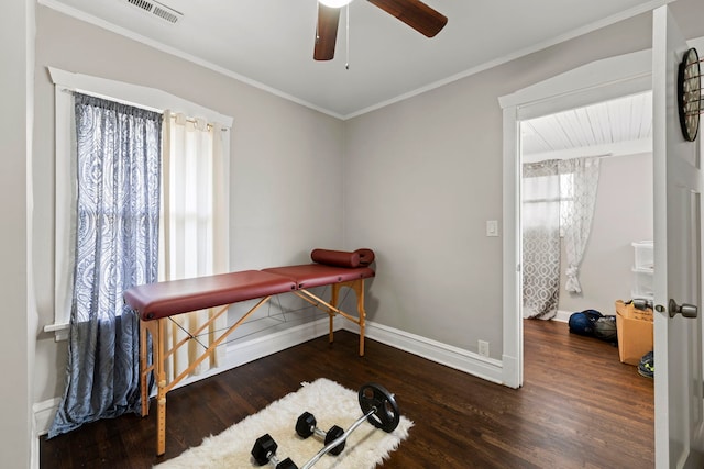 miscellaneous room featuring ceiling fan, dark hardwood / wood-style floors, and ornamental molding