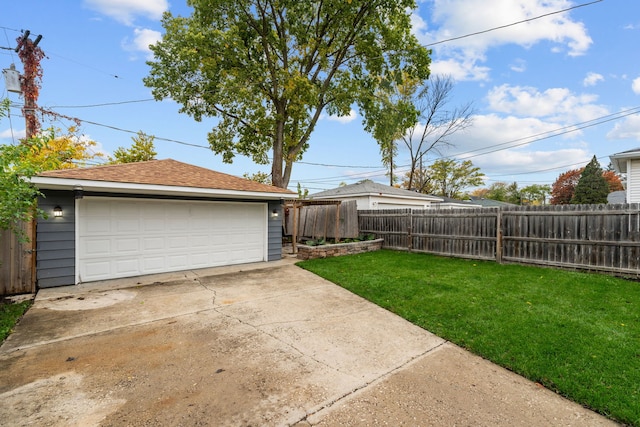 view of yard with an outbuilding and a garage