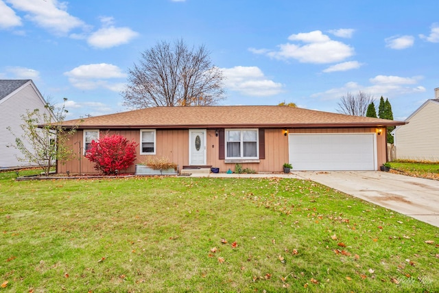 ranch-style house featuring a garage and a front lawn