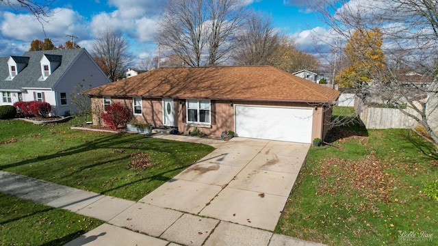 view of front of house with a garage and a front lawn