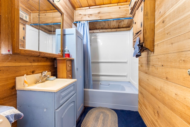 bathroom featuring wooden walls, vanity, wood ceiling, and shower / tub combo