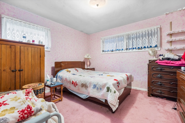 bedroom featuring light colored carpet