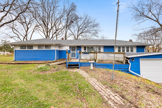 ranch-style home with a garage and a front yard