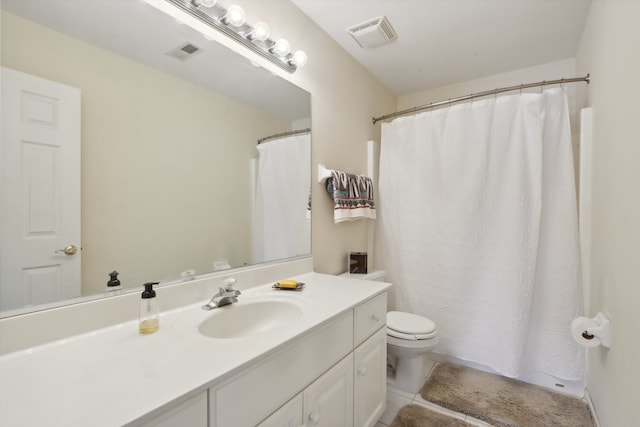 bathroom featuring walk in shower, tile patterned flooring, vanity, and toilet