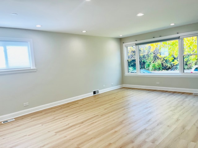 unfurnished room with light hardwood / wood-style flooring