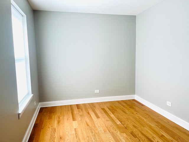 unfurnished room featuring hardwood / wood-style floors