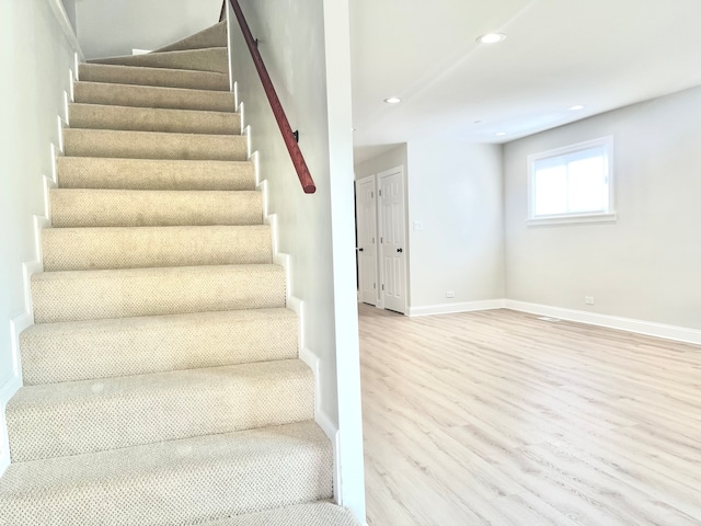 stairway with wood-type flooring