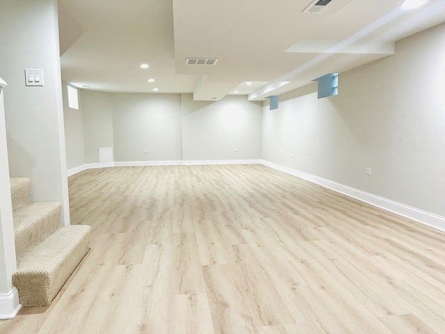 basement featuring light hardwood / wood-style flooring