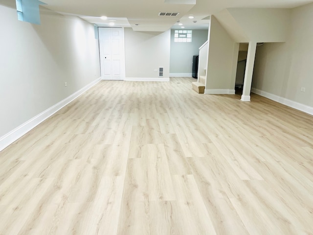 basement featuring light hardwood / wood-style floors