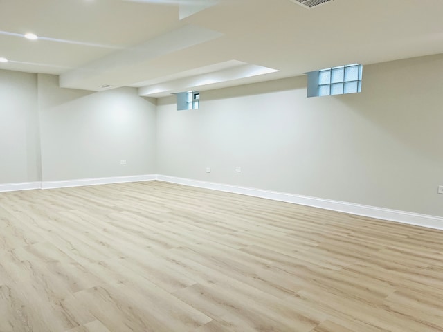 basement featuring light wood-type flooring