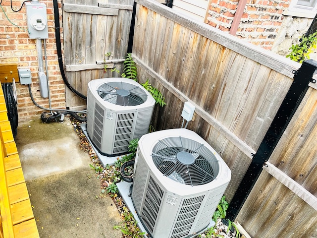 details with central AC unit and concrete floors