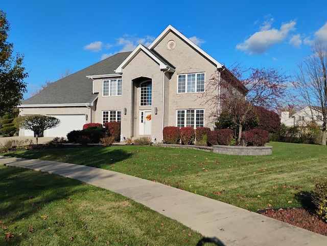 view of front property featuring a garage and a front yard