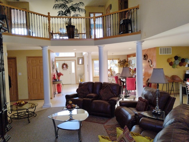 living room featuring a towering ceiling