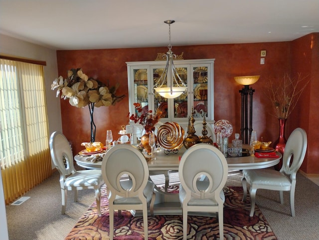 view of carpeted dining space