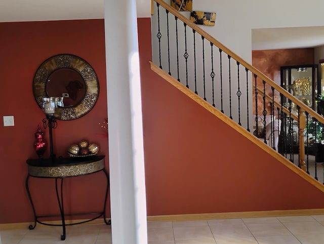 stairs with tile patterned floors