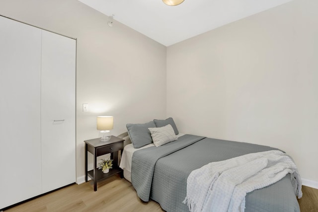 bedroom with light hardwood / wood-style flooring