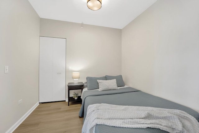 bedroom with light wood-type flooring