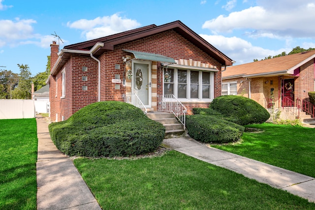 bungalow with a front yard