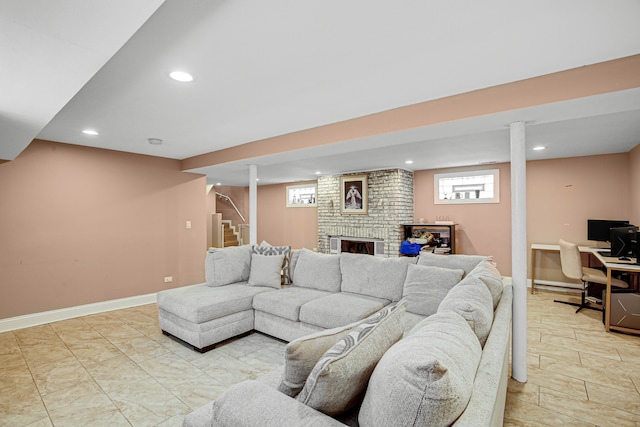 living room with plenty of natural light and a brick fireplace