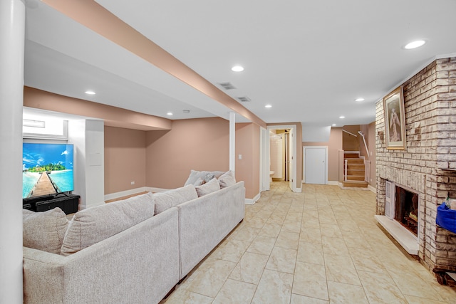 living room with a brick fireplace