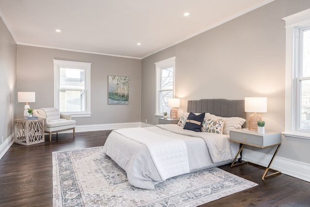 bedroom with dark wood-type flooring and crown molding