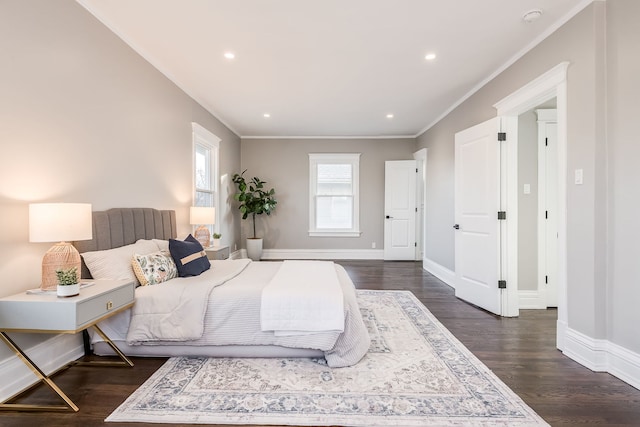 bedroom featuring ornamental molding and dark wood-type flooring