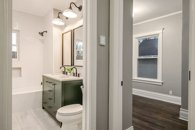 full bathroom featuring vanity, tiled shower / bath combo, crown molding, toilet, and hardwood / wood-style flooring