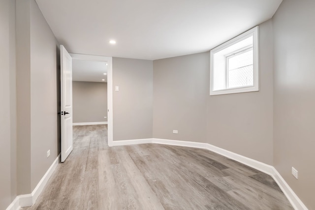 unfurnished room with light hardwood / wood-style flooring