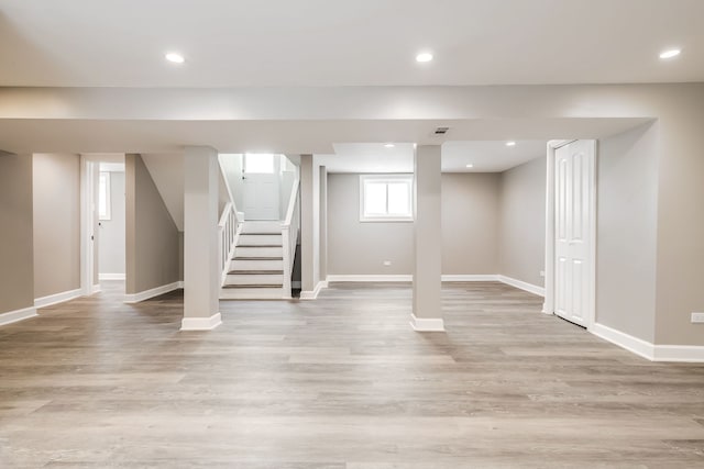 basement featuring light hardwood / wood-style floors