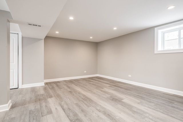 spare room featuring light wood-type flooring