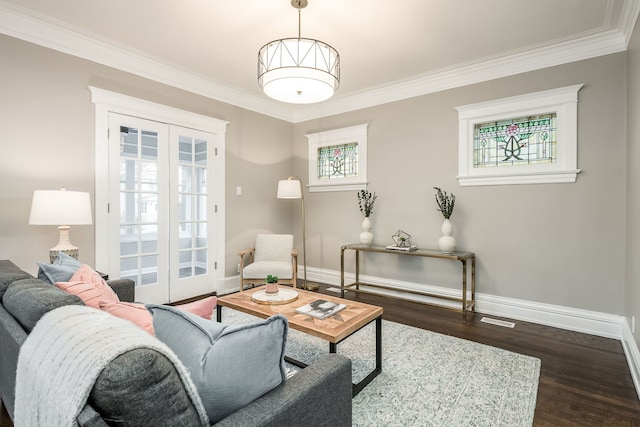 living room with ornamental molding, dark wood-type flooring, and french doors