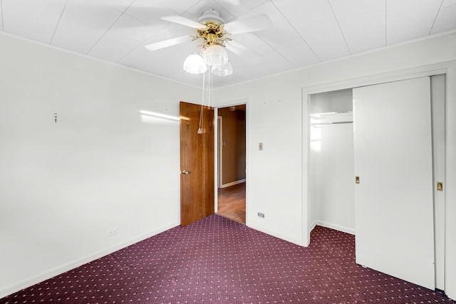 unfurnished bedroom featuring carpet flooring, ceiling fan, and a closet