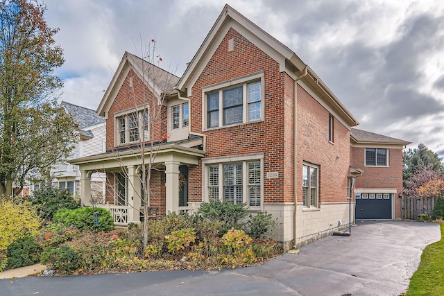 view of front of home with a porch and a garage