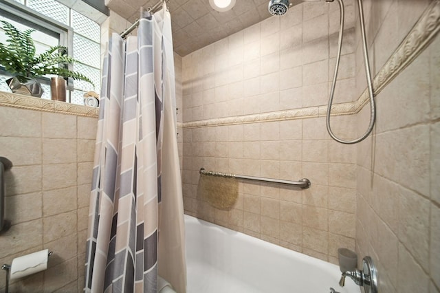 bathroom with shower / bath combo