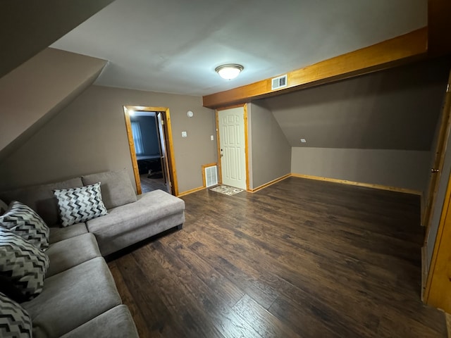 additional living space with dark hardwood / wood-style floors and lofted ceiling