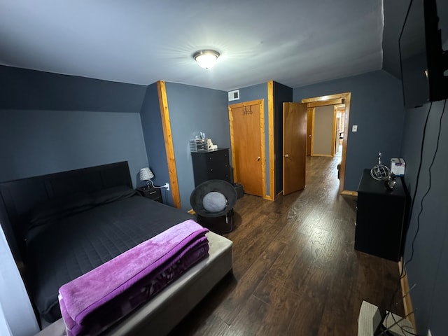 bedroom featuring dark wood-type flooring