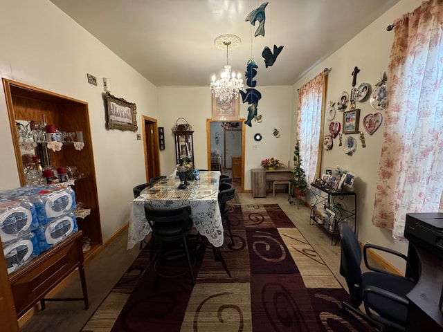 carpeted dining space with a notable chandelier