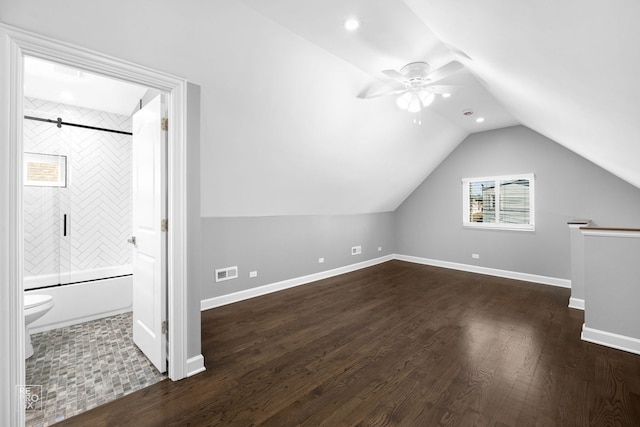 additional living space with ceiling fan, dark hardwood / wood-style flooring, and lofted ceiling