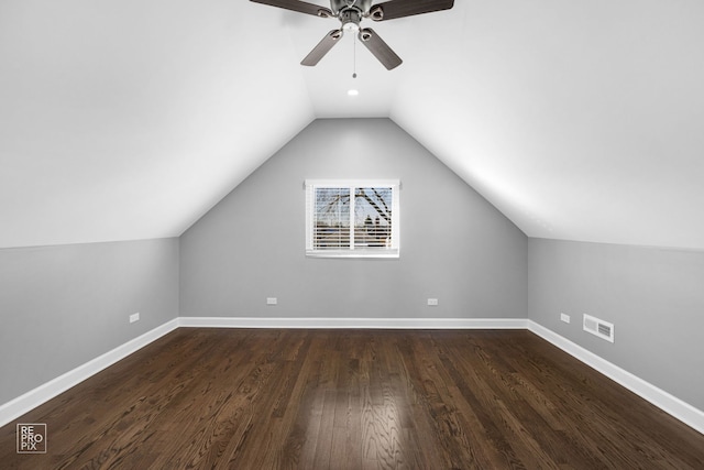 bonus room with dark hardwood / wood-style floors, vaulted ceiling, and ceiling fan