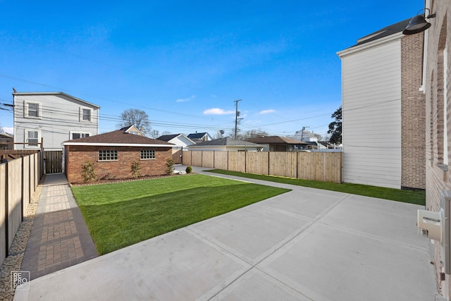 view of yard with an outbuilding and a patio area